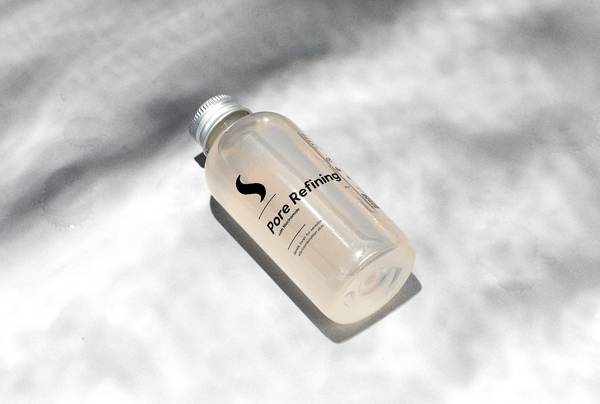 Pore refining toner